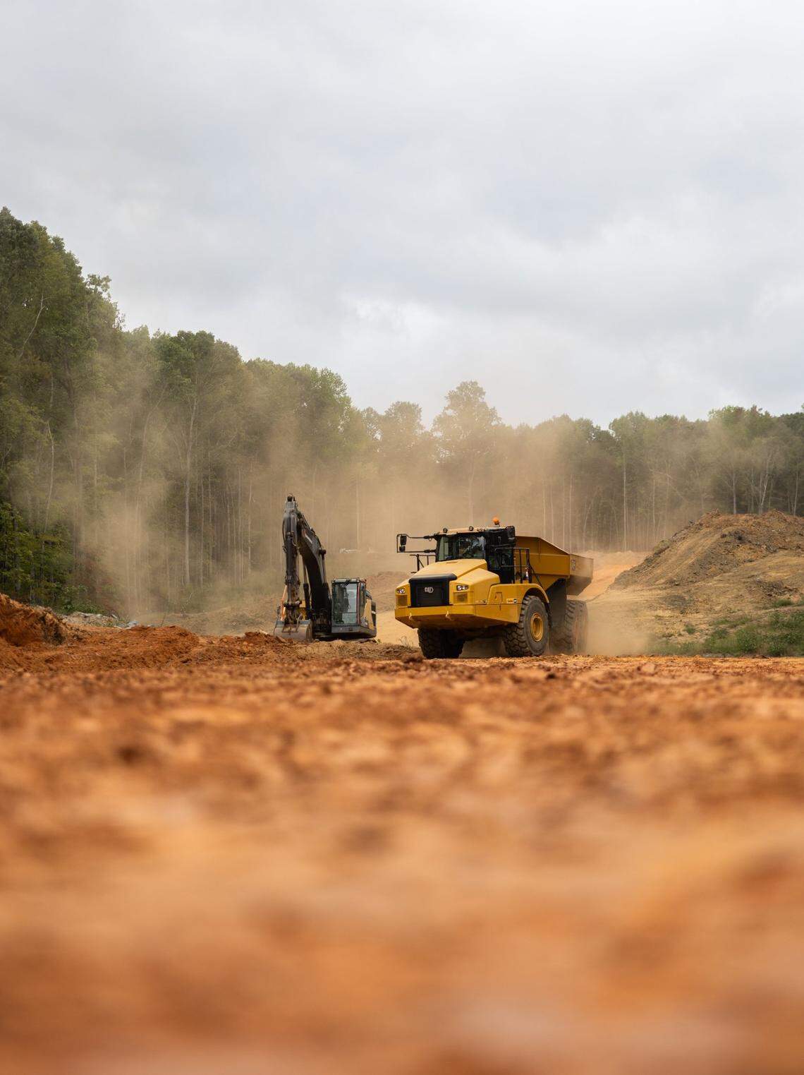 A construction crew works on the East West Connector in Mooresville, N.C., on Friday, September 13, 2024. Two years from completion, the connector has already attracted major housing subdivisions and a planned mega mixed-used community.