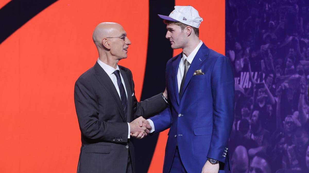 Liam McNeeley stands with NBA commissioner Adam Silver after being selected as the 29th pick by the Phoenix Suns in the first round of the 2025 NBA Draft at Barclays Center. The Hornets receive McNeeley in a draft night deal with the Suns.