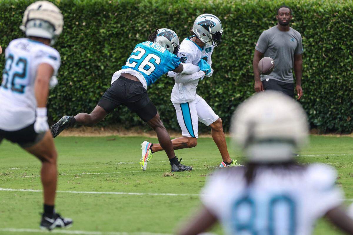 Panthers cornerback Donte Jackson, second from left, breaks up a pass to wide receiver Robbie Anderson in the end zone during the Back Together practice in Gibbs Stadium at Wofford College on Saturday, July 30, 2022 in Spartanburg, SC.