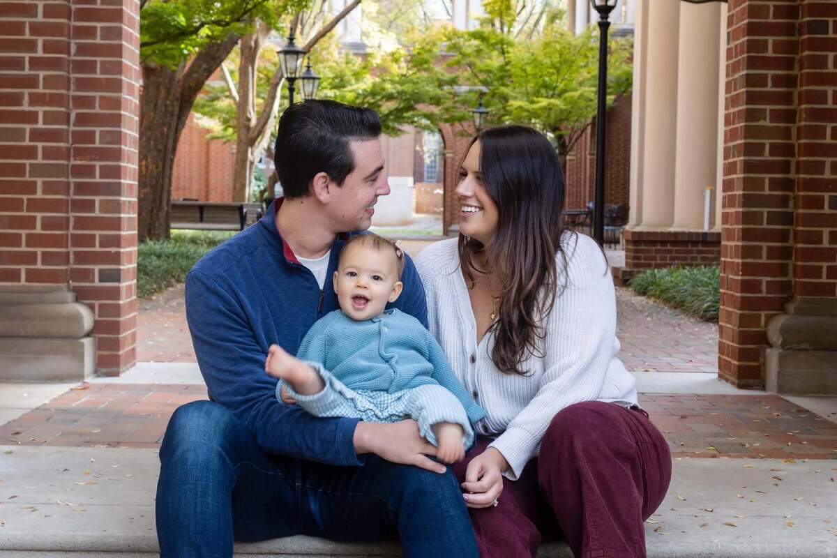 “Everyone told us: ‘The second you think you’re pregnant, you need to start looking for a daycare,’” says Camille McDowell, pictured here with her husband Ben and their young daughter. “And I think we probably didn’t take that seriously enough.”