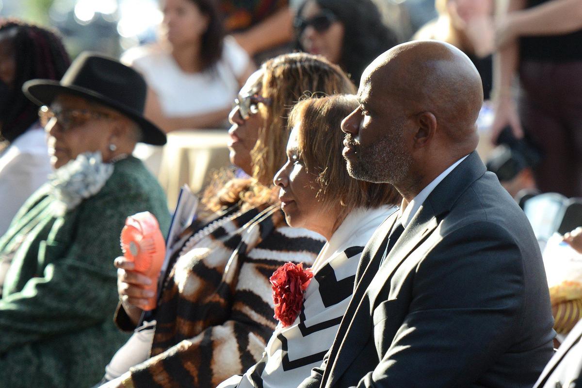 (L-R) Dignitaries including Vilma Leake, Debra Weeks, Pamela Willams Coote and Edward Timberlake took turns speaking and listening at the ribbon-cutting ceremony for the C.W. Williams Community Health Center on Wilkinson Boulevard. The center provides care for an under-served section of west Charlotte.