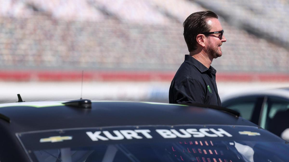 Kurt Busch stands by his car during the Paint Pit Wall Pink event at the Charlotte Motor Speedway in Charlotte, N.C., on Tuesday, September 28, 2021.