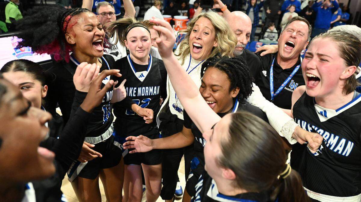 The Lake Norman girls’ basketball team celebrates their 43-41 victory over Wakefield in the NCHSAA 4A state championship game on Saturday, March 15, 2025 at Lawrence Joel Veterans Memorial Coliseum in Winston-Salem, N.C.