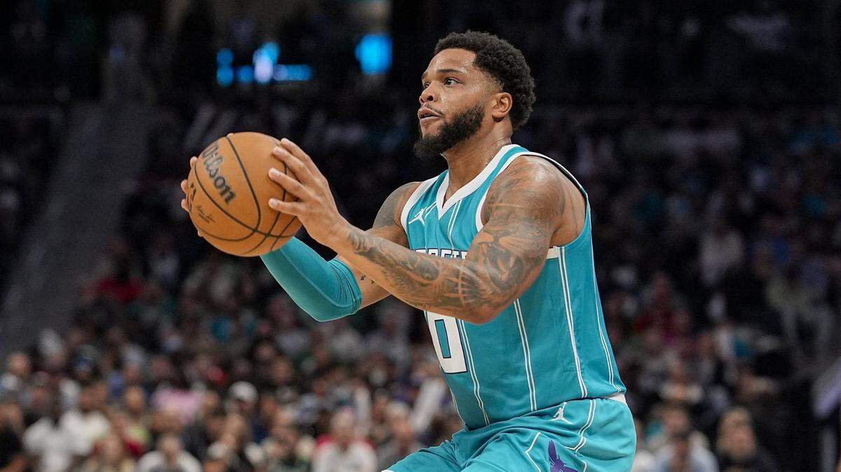 Charlotte Hornets forward Miles Bridges (0) pulls up for a three point shot against the Boston Celtics during the second half at the Spectrum Center.