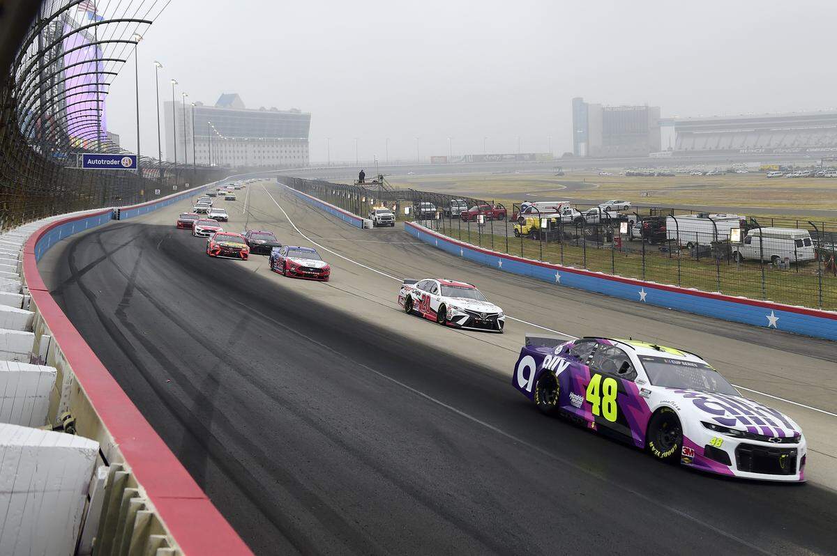 FORT WORTH, TEXAS - OCTOBER 25: Jimmie Johnson, driver of the #48 Ally designed by Noah Sweet Chevrolet, and Erik Jones, driver of the #20 Sport Clips Toyota, lead the field during the NASCAR Cup Series Autotrader EchoPark Automotive 500 at Texas Motor Speedway on October 25, 2020 in Fort Worth, Texas. (Photo by Jared C. Tilton/Getty Images)