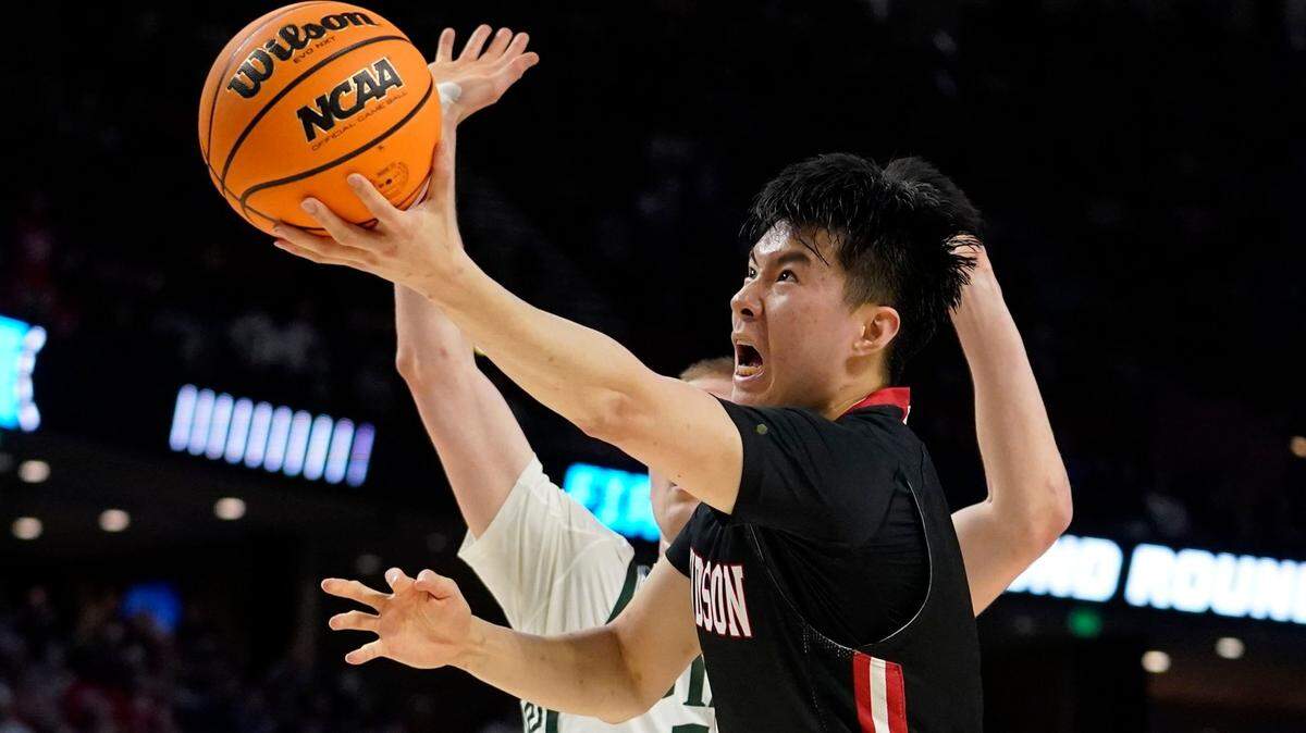 Davidson’s Hyunjung Lee (1) shoots against Michigan State during the first half of a college basketball game in the first round of the NCAA tournament Friday, March 18, 2022, in Greenville, S.C. (AP Photo/Brynn Anderson)
