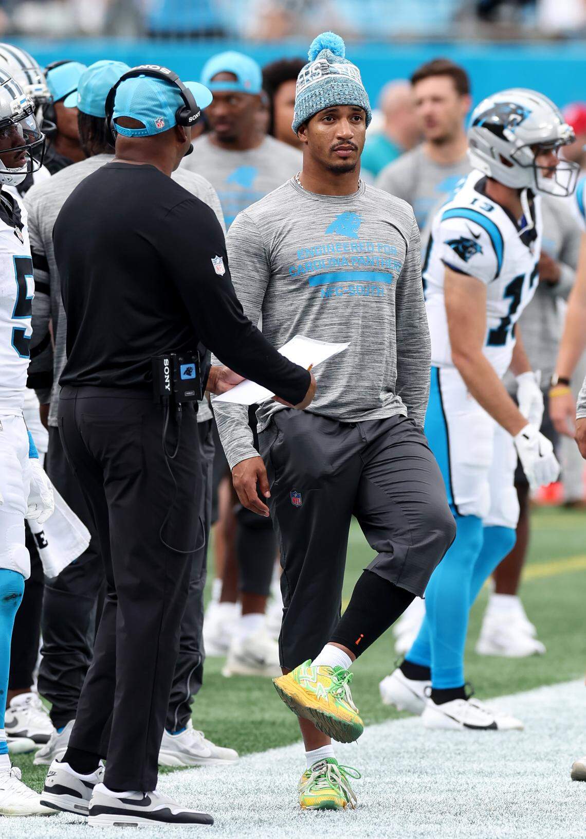 Carolina Panthers running back Chuba Hubbard stretches on the sideline during the team's game against the Miami Dolphins on Sunday, October 5, 2025 at Bank of America Stadium in Charlotte, NC. The Panthers defeated the Dolphins 27-24.