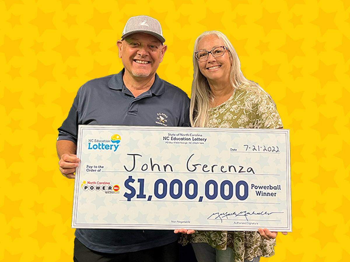 John Gerenza and his wife, Caroline, pose at N.C. lottery headquarters in Raleigh on Thursday, July 21, 2022, after his $1 million Powerball win.