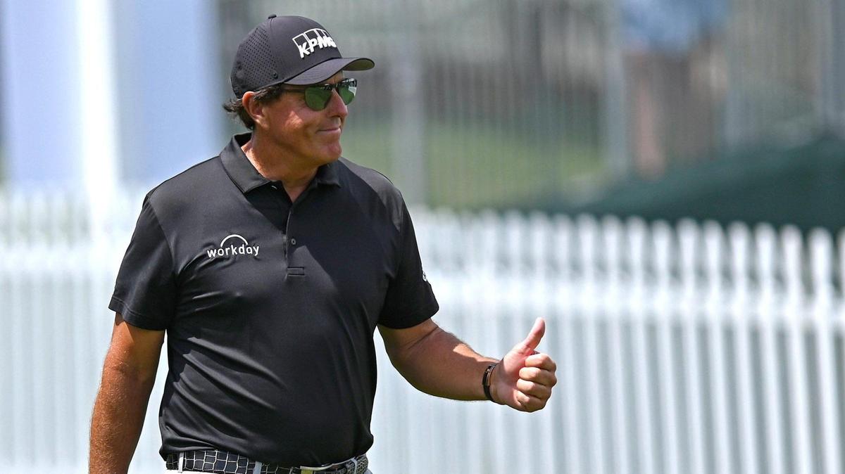 Phil Mickelson, shown giving a thumbs-up to a fan in Charlotte in 2021, won’t have any role in the Queen City’s President Cup in 2022 due to his suspension from the PGA Tour.