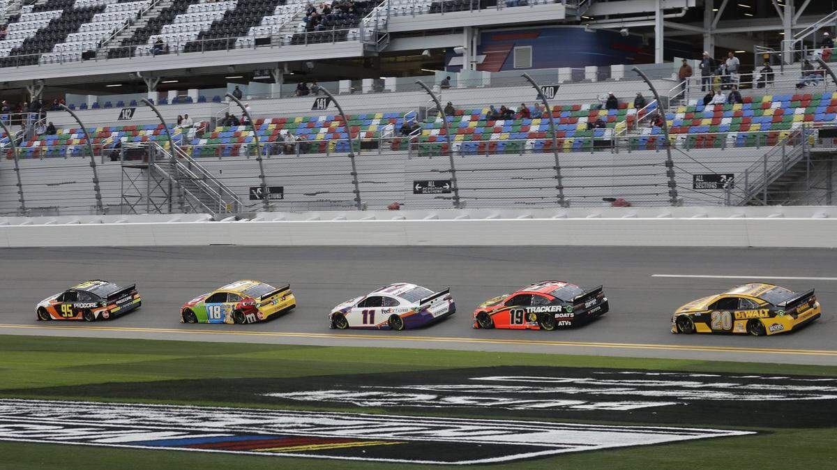 Christopher Bell (95), Kyle Busch (18), Denny Hamlin (11), Martin Truex Jr. (19) and Erik Jones (20) draft each other during a practice session for the NASCAR Daytona 500 auto race Friday, Feb. 14, 2020, at Daytona International Speedway in Daytona Beach, Fla. (AP Photo/Chris O’Meara)