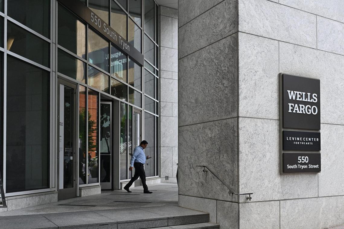 Just a week after Wells Fargo’s $1.95 trillion asset cap punishment over its fake sales scandal was removed by the Federal Reserve, Chief Financial Officer Mike Santomassimo details where the bank plans to grow during Tuesday’s Morgan Stanley U.S. Financials Conference. Shown, people walk outside of the Wells Fargo uptown Charlotte corporate office on June 4, 2025.