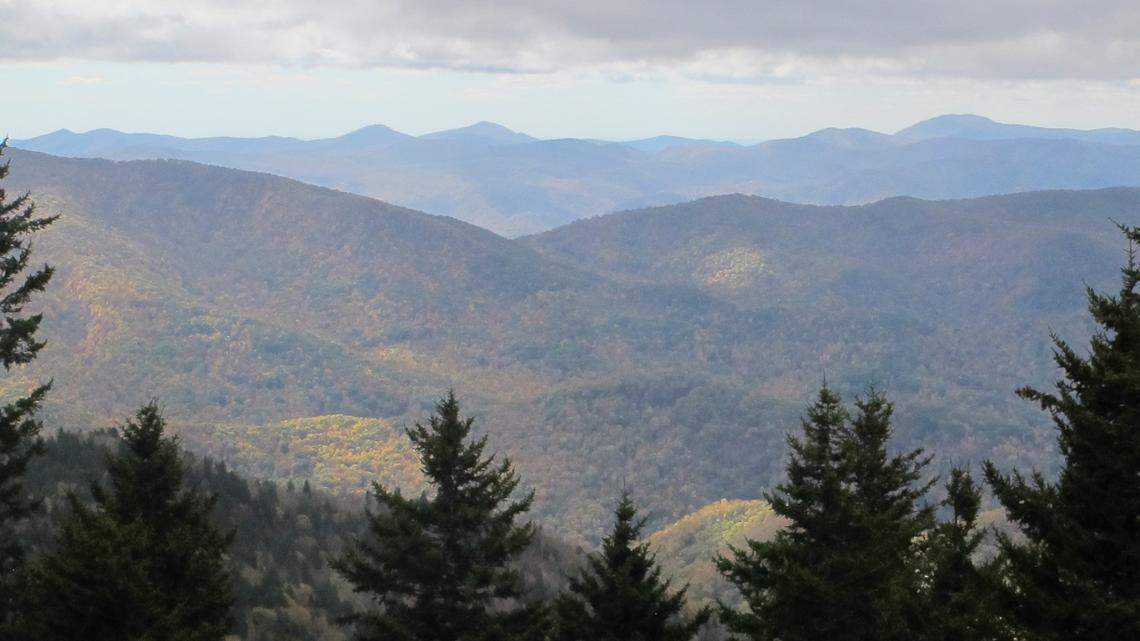 The western North Carolina mountains are seen from a lookout on the Blue Ridge Parkway in Asheville, North Carolina. A national radio host’s tweets about the city set off a battle on Twitter.