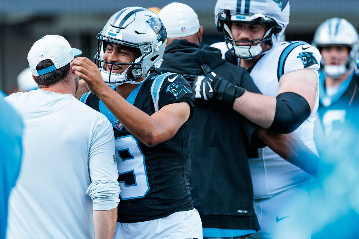 Panthers quarterback Bryce Young walks onto the field during Fan Fest on Friday, July 31, 2026, in Bank of America Stadium.