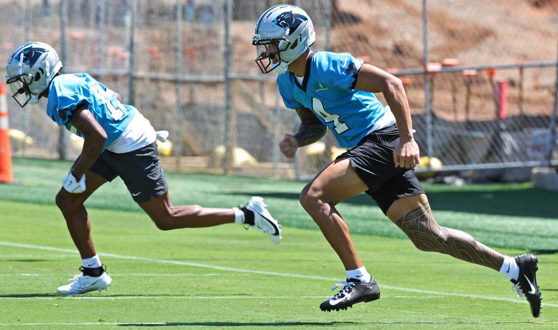 Carolina Panthers wide receiver Tetairoa McMillan, right, races across the field during the team’s rookie minicamp practice on Friday, May 9, 2025.