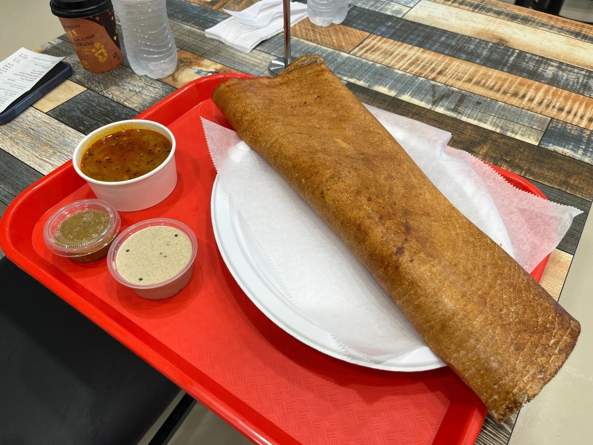 Triveni Market’s onion masala dosa comes with three sauces for dipping, each with different flavors and textures.