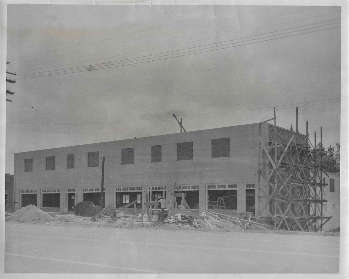 Construction of the building that would house Piedmont Tool and Plumbing Supply, documented in 1945. This is the view from the street. The shop would be constructed in the basement, and accessed from the rear.