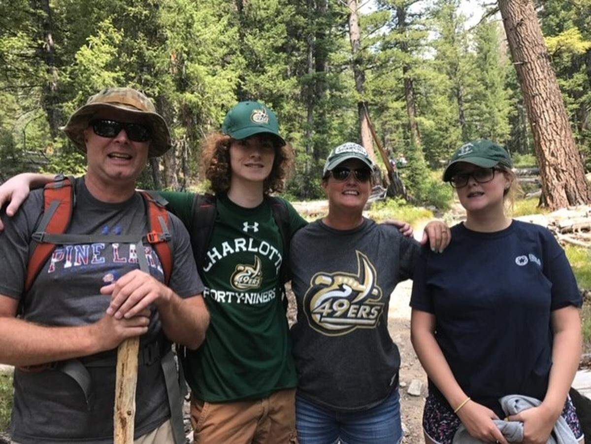 Brian, Reed, Julie and Mallory Parlier in a 2017 family photo. Of his trademark hairstyle, Julie says: “Once it started growing out, that’s what happened — the curls. I used to have curly hair, but I say when I gave birth to him, I gave him my curls as well.”