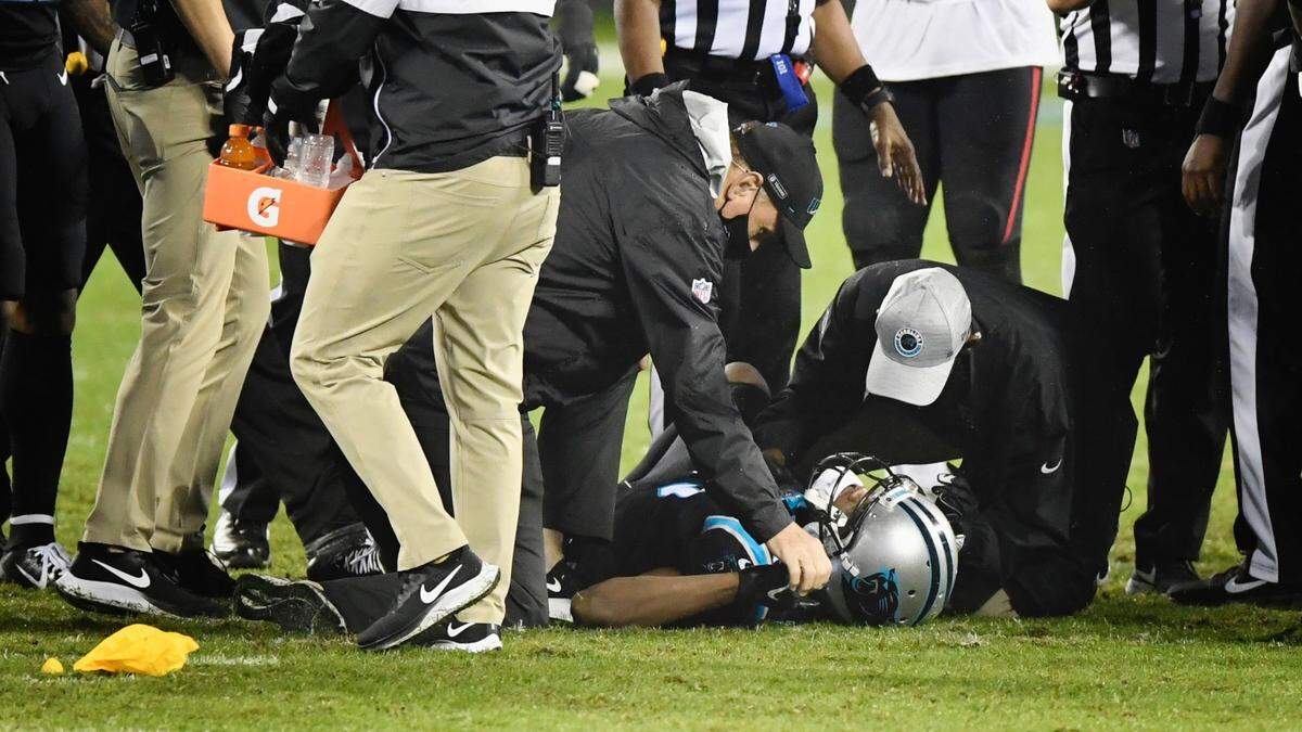 Carolina Panthers quarterback Teddy Bridgewater is tended to on the field after being injured on a late hit in the third quarter against Atlanta Thursday. The Falcons won, 25-17.