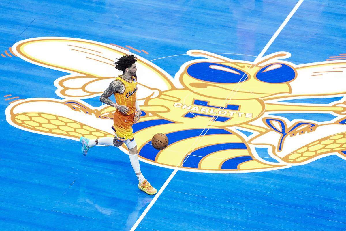 Charlotte Hornets guard LaMelo Ball (1) brings the ball up court during the first half of an NBA basketball game against the Cleveland Cavaliers, Friday, Feb. 20, 2026, in Charlotte, N.C. 