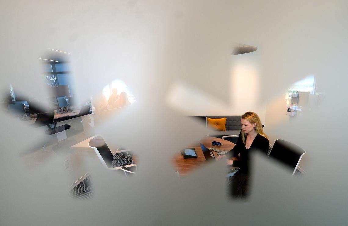 Snowflakes are etched on a frosted glass window looking into a conference room on the eighth floor of Credit Karma’s new office.
