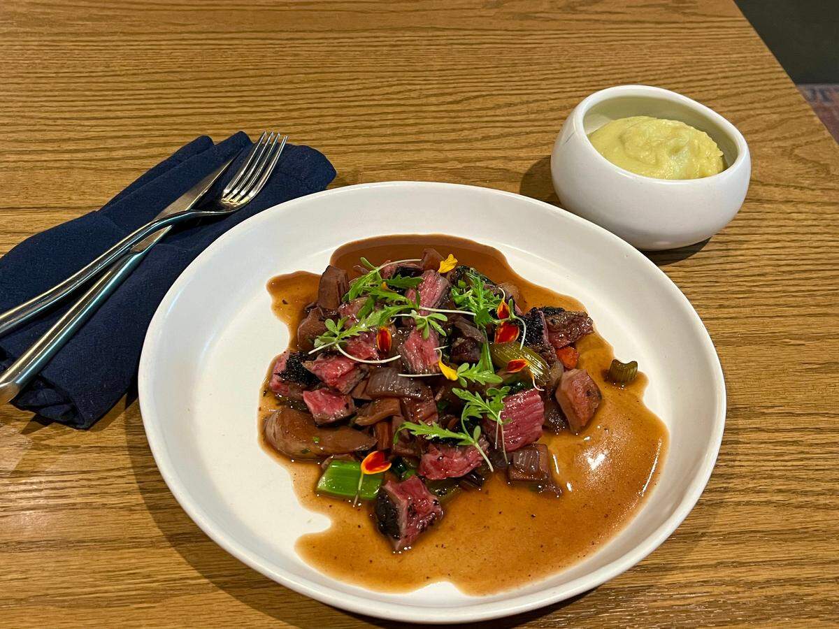 The mushroom bourguignon at Restaurant Constance is served.
