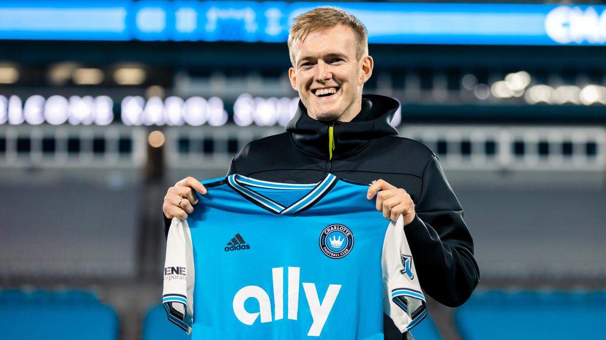 Polish striker Karol Świderski signed with Charlotte FC, the city’s new Major League Soccer expansion team, Wednesday.