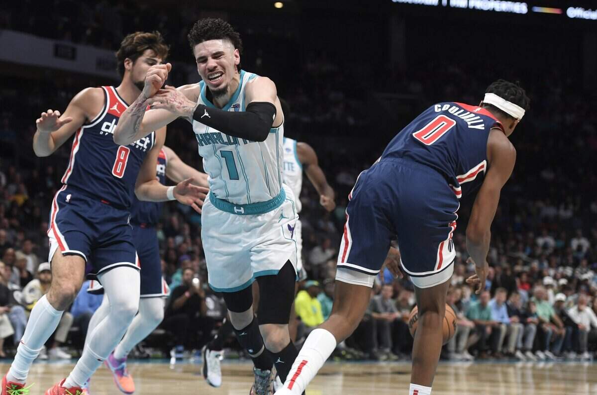 Charlotte Hornets guard LaMelo Ball (1) looses the ball to Washington Wizards guard Bilal Coulibaly (0) during the first half at the Spectrum Center.
