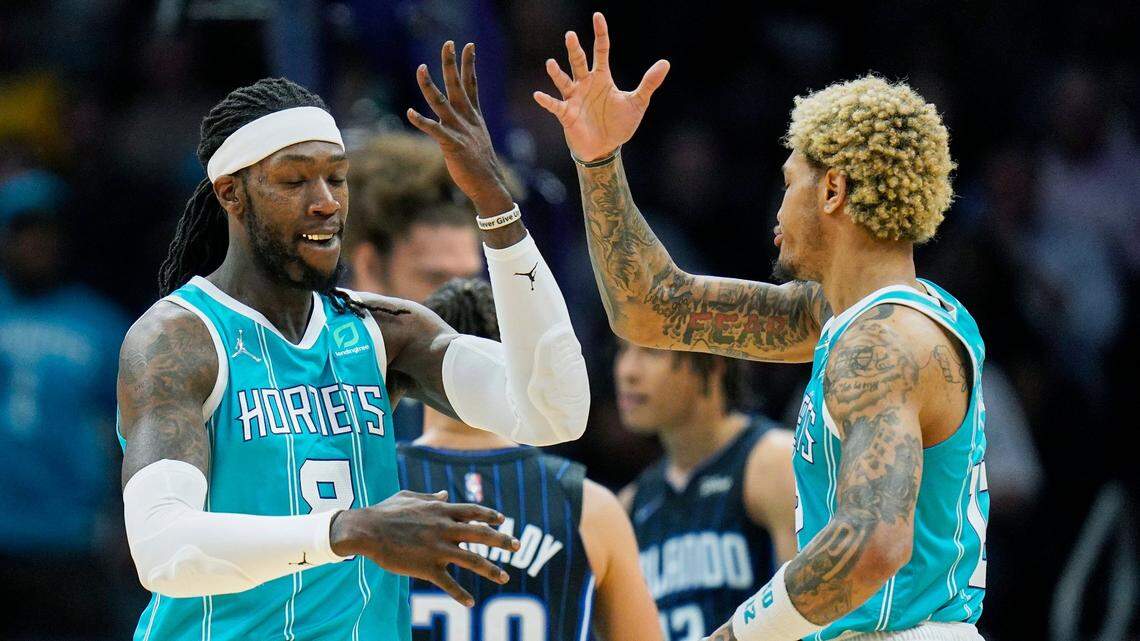 Charlotte Hornets center Montrezl Harrell, left, celebrates a basket with teammate Kelly Oubre Jr., right, against the Orlando Magic last week. The Hornets will lean on veterans such as Harrell and Oubre to get them into the NBA playoffs.