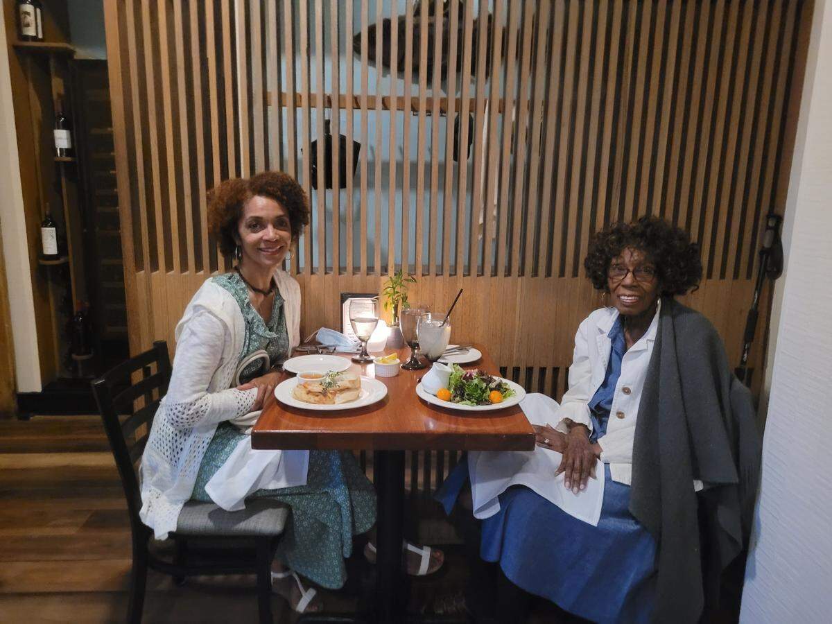 Race, Culture and Community Engagement editor Lisa Vernon Sparks, shown here enjoying dinner in 2022 with her mother, Ethel Vernon, has written about perimenopause and has experienced symptoms herself.