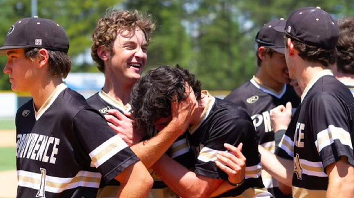 Providence Players line up to get their State Championship awards. (Kelly Hood/Charlotte Observer)