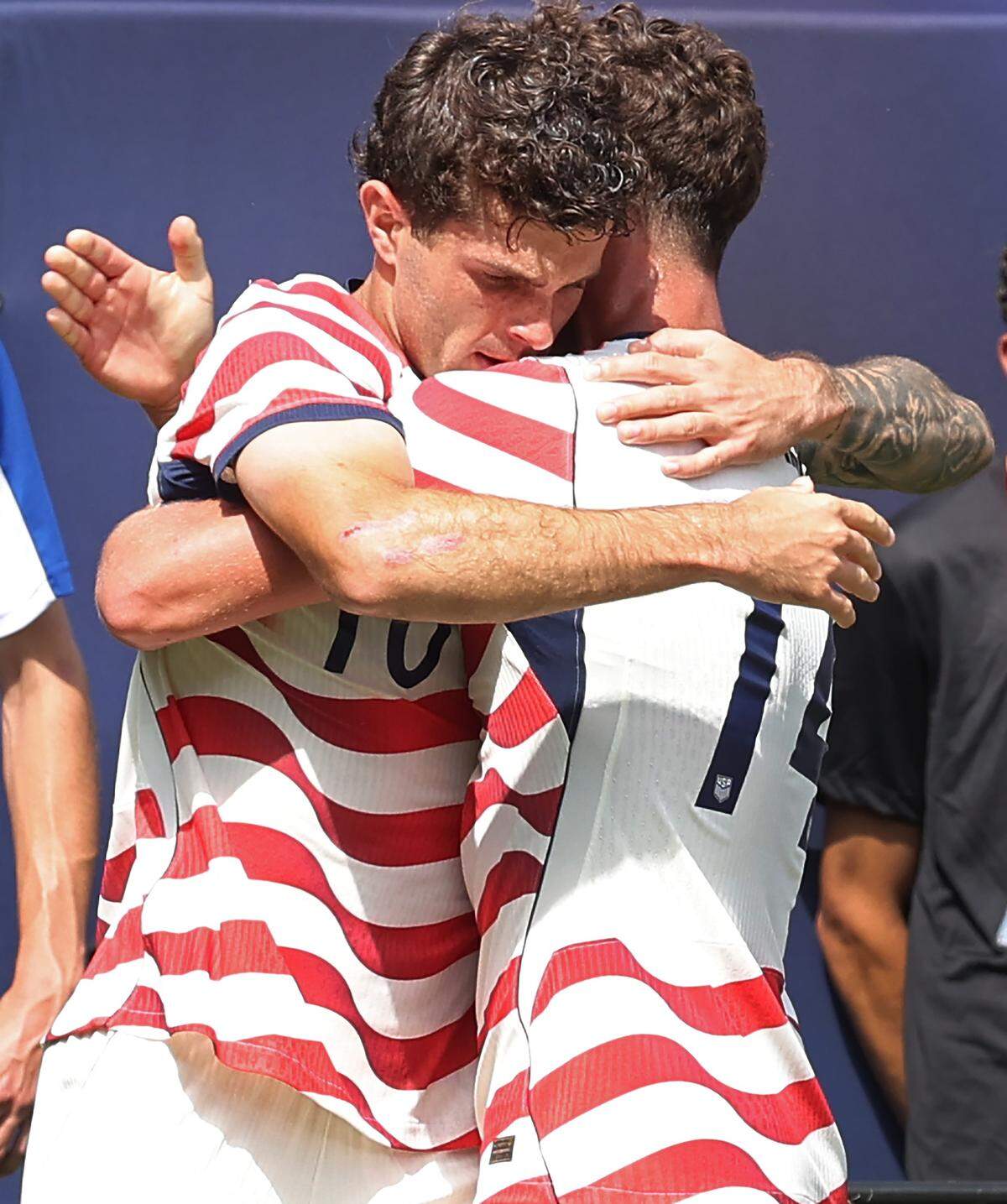 USMNT'S forward Christian Pulisic, left, is hugged by midfielder Sebastian Berhalter, right, after Pulisic scored a goal during action against Senegal on Sunday, May 31, 2026 at Bank of America Stadium in Charlotte, NC.