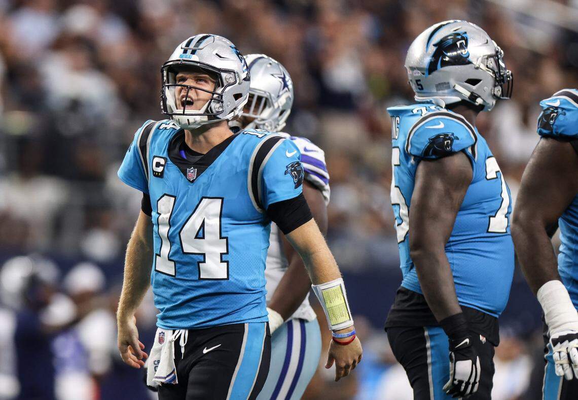 Carolina Panthers quarterback Sam Darnold reacts after being sacked one of five times by the Dallas Cowboys on Sunday in Arlington, Texas.