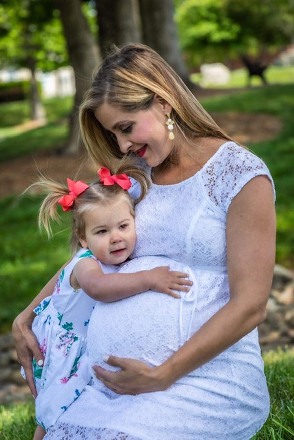Allison Latos with her daughter Hope, photographed while carrying her second child.