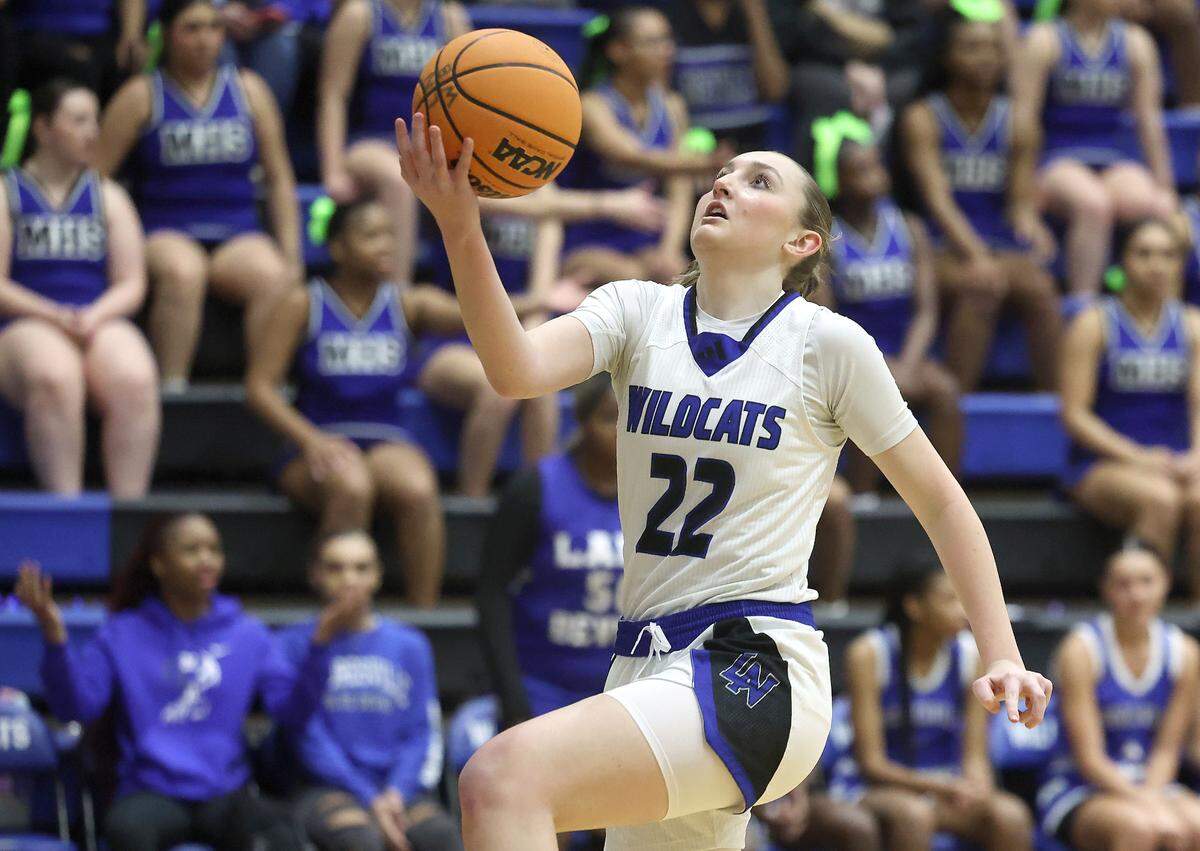 Lake Norman’s Samantha Shehan drives to the basket for a layup during action against Mooresville on Wednesday, January 22, 2025 at Lake Norman High School.