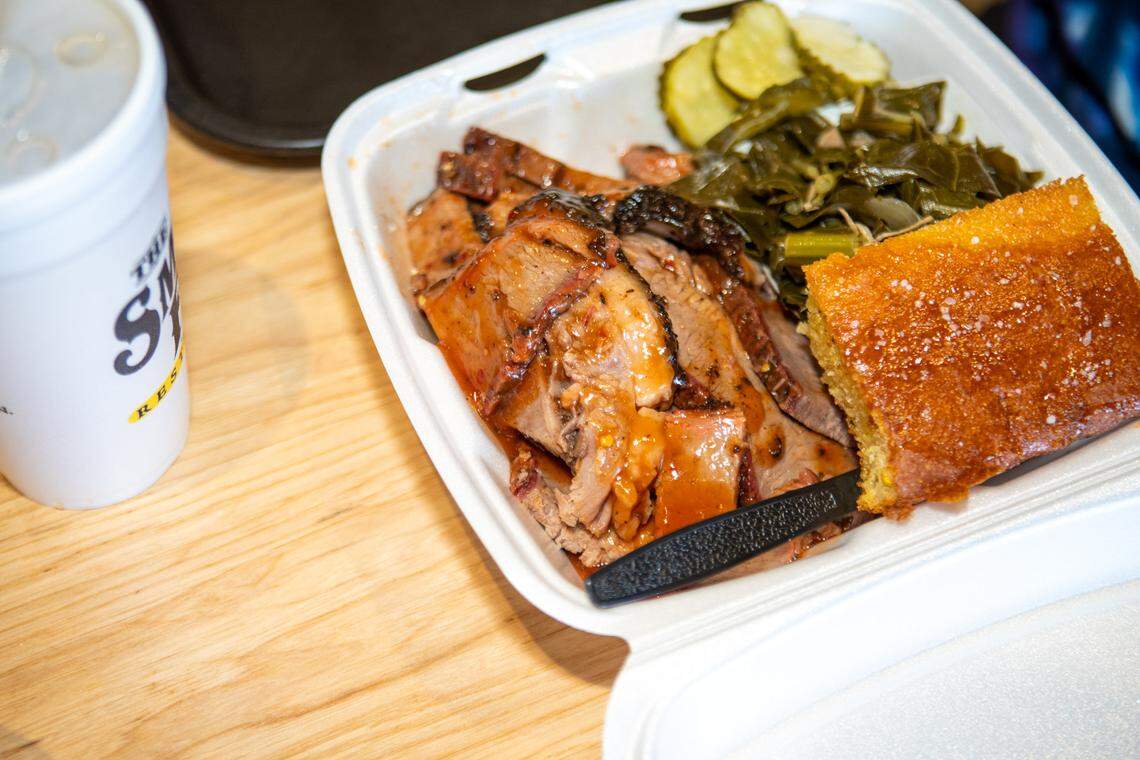 A takeout brisket plate with collards and cornbread at The Smoke Pit in Concord.