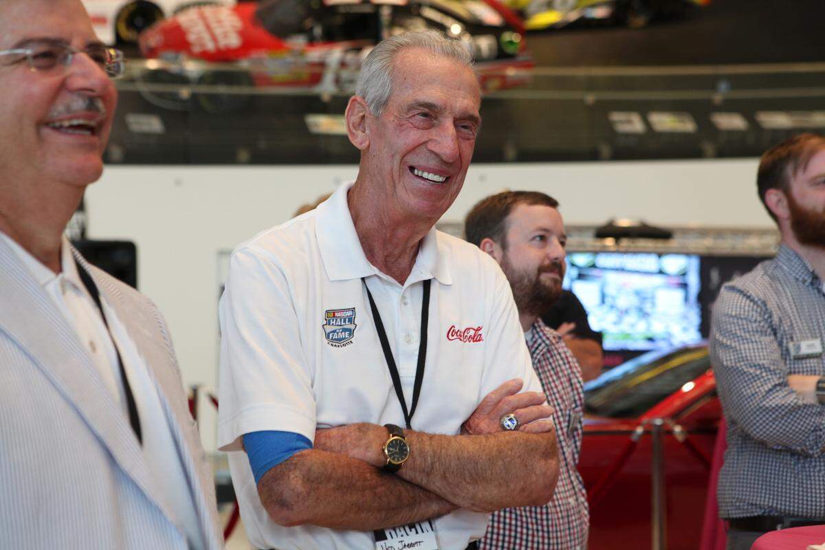 Ned Jarrett, a retired race car driver, smiles as he is recognized by Mike Curb, a long time race car owner at the media event for the NASCAR Hall of Fame's newest exhibit, Rockin' & Racin', on Tuesday, June 24, 2014.Media Event for Rockin' and Racin' the Nascar Hall of Fame's newest exhibit