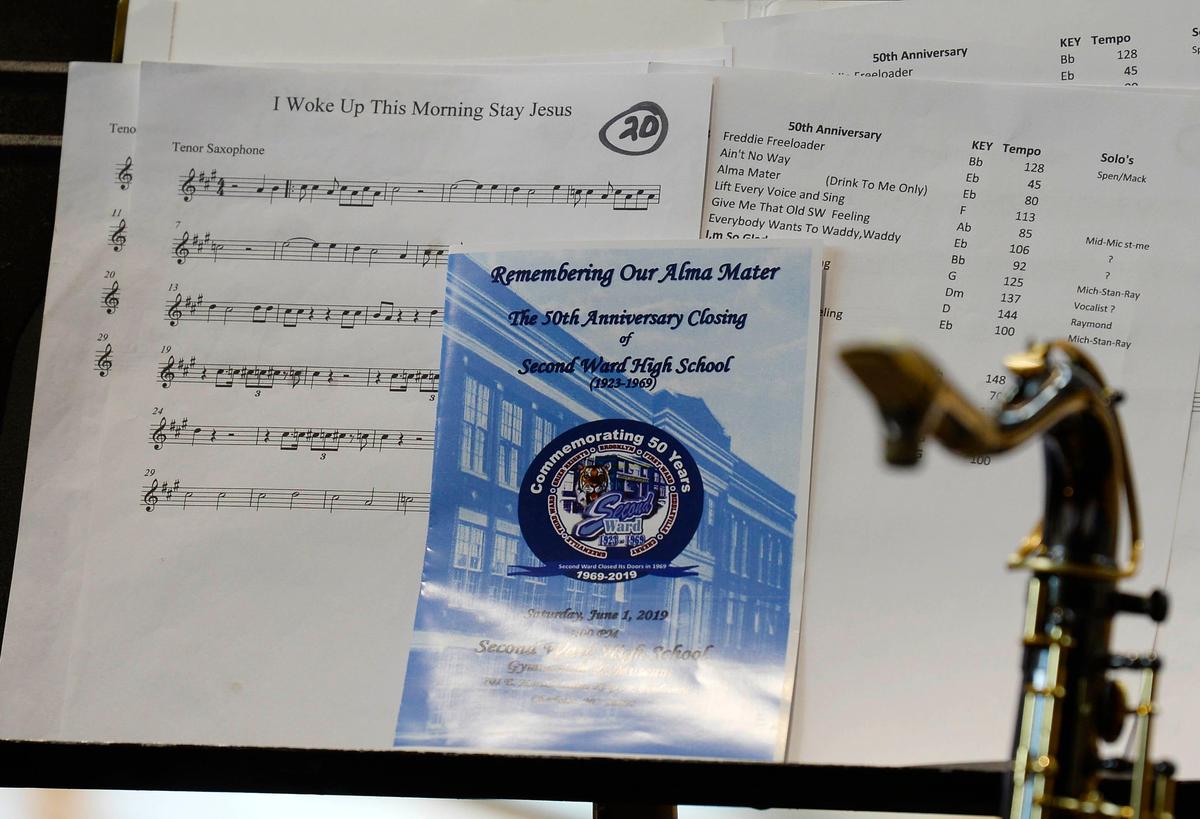 Music is placed on a stand during the 50th anniversary of the closing of Second Ward High School at the Second Ward High School Gymnasium and Museum on Saturday, June 1, 2019. After the school closed its doors in 1969, it was bulldozed as part of urban renewal and the destruction of the Brooklyn neighborhood.