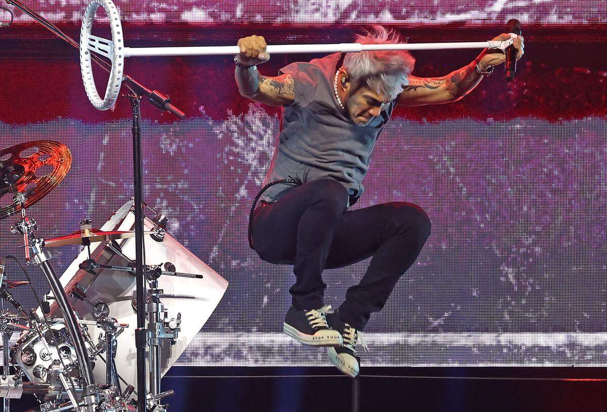 Journey lead vocalist Arnel Pineda leaps off the drum kit riser during the bands Final Frontier Tour at Spectrum Center in Charlotte, NC on Wednesday, May 20, 2026
