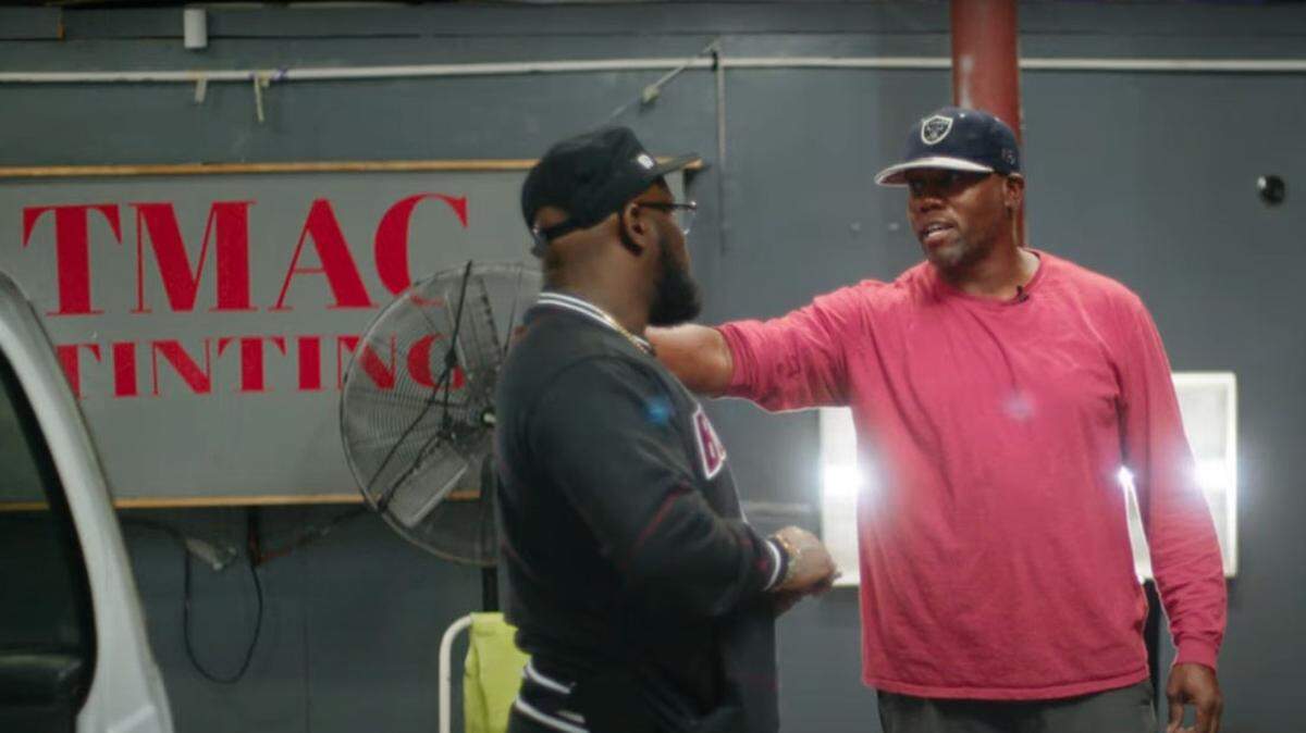Sala Abdallah, left, talks with Roy “Buzzie” Hubbert, owner of TMAC Tinting in Durham. Both are formerly incarcerated people. Hubbert now runs his own business and employs 18 people. Abdallah works for the Southern Coalition for Social Justice helping other formerly incarcerated people. 