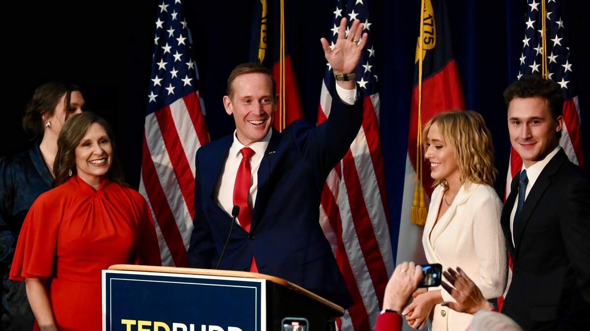 North Carolina’s new Senator-elect, Republican Ted Budd, waves to supporters as he and his family celebrate his victory over Cheri Beasley on Tuesday, November 8, 2022.