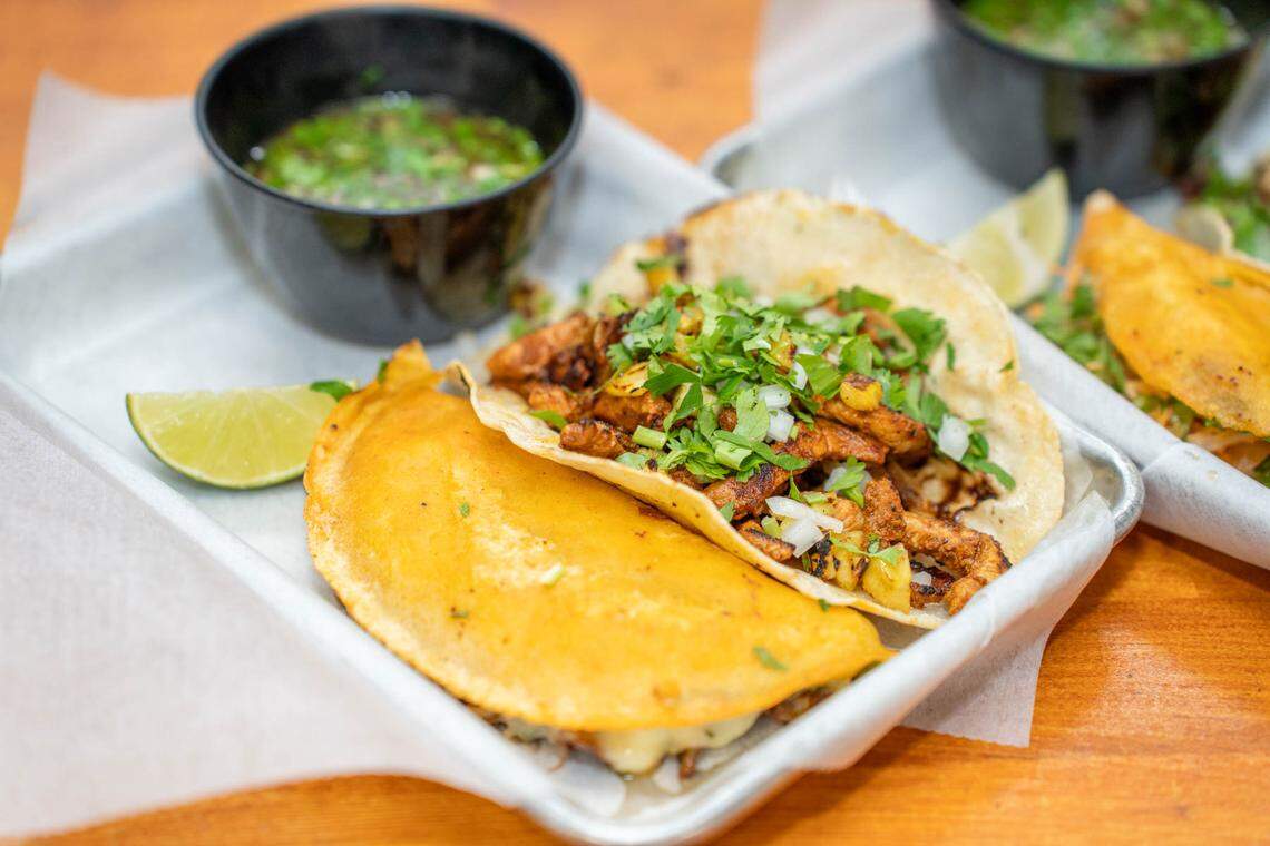 The Chicken Birria Taco at Birritaco includes a crispy seared corn tortilla, chicken tinga, chihuahua cheese, cilantro and onions with a side of consommé.