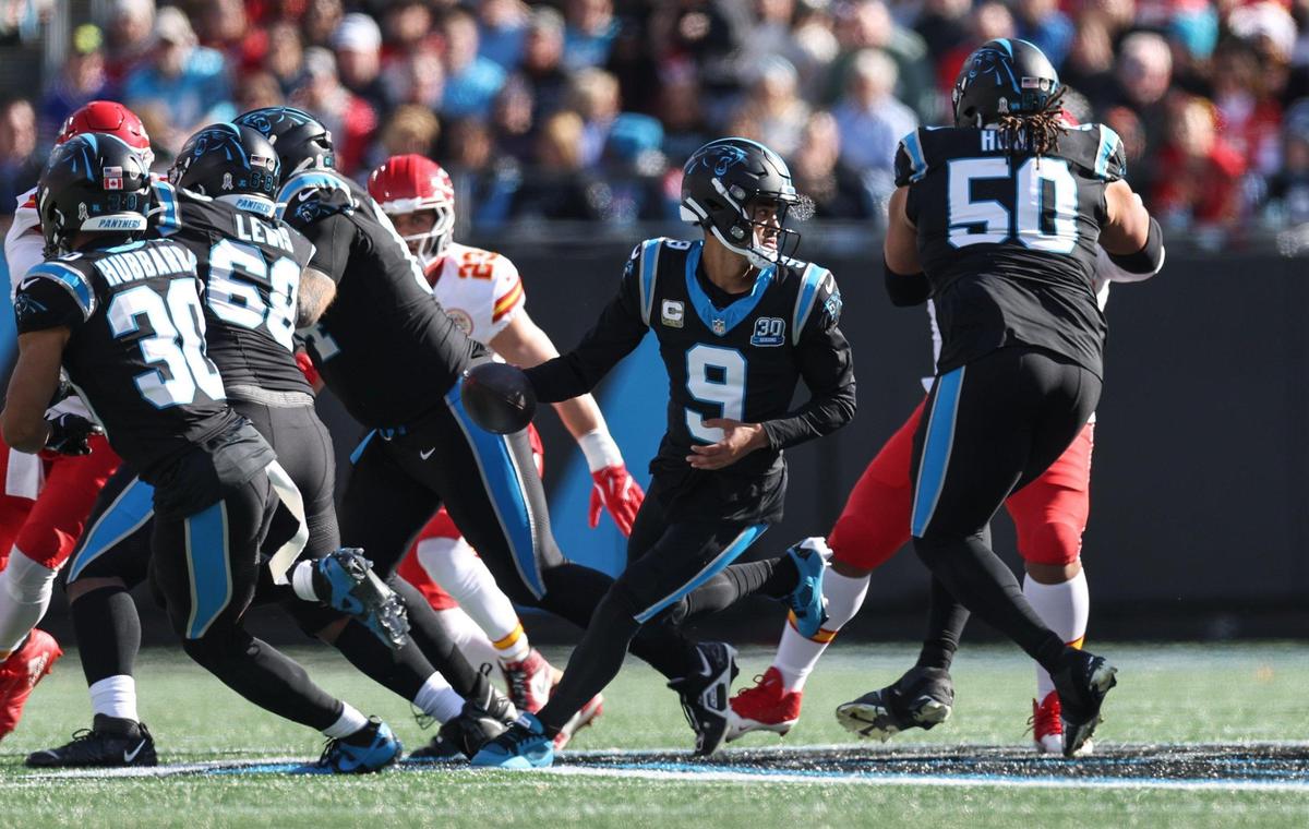 Panthers quarterback Bryce Young, center, scans the field from the pocket during the game against the Chiefs at Bank of America Stadium in Charlotte, NC on Sunday, November 24, 2024.