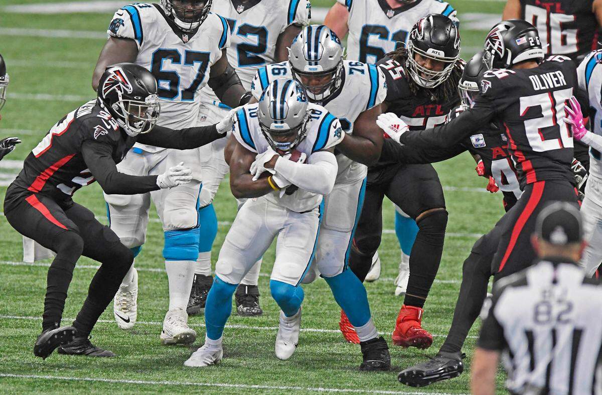 Carolina Panthers wide receiver Curtis Samuel (10) wraps up the ball with both hands on a running play against Atlanta on Oct. 11th.