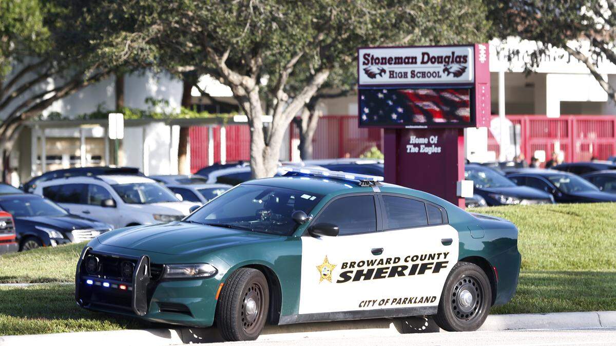 A Broward County Sheriff’s Office vehicle is parked outside Marjory Stoneman Douglas High School, Wednesday, Aug. 15, 2018, in Parkland, Fla. Students at the school returned Wednesday, to a more secure campus as they began their first new school year since a gunman killed 17 people in the freshman building.