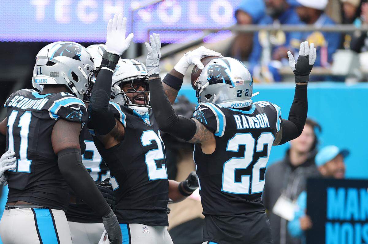 Carolina Panthers safety Nick Scott celebrates with fellow safety Lathan Ransom after his interception against the Los Angeles Rams during the first quarter at Bank of America Stadium on Nov. 30, 2025 in Charlotte, North Carolina. (Photo by Grant Halverson/Getty Images)