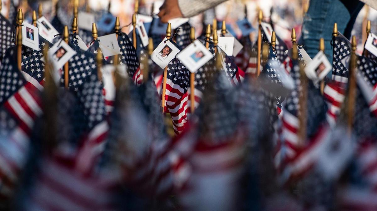 Photo cards are displayed on American flags to remember those who lost their lives on 9/11, in Charlotte, North Carolina.