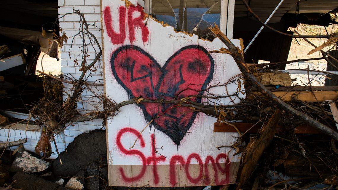 A sign of encouragement rests amid the debris of a gas station destroyed by Hurricane Helene in Swannanoa, N.C., on Oct. 26, 2024. Photo by Chrissy Wang.