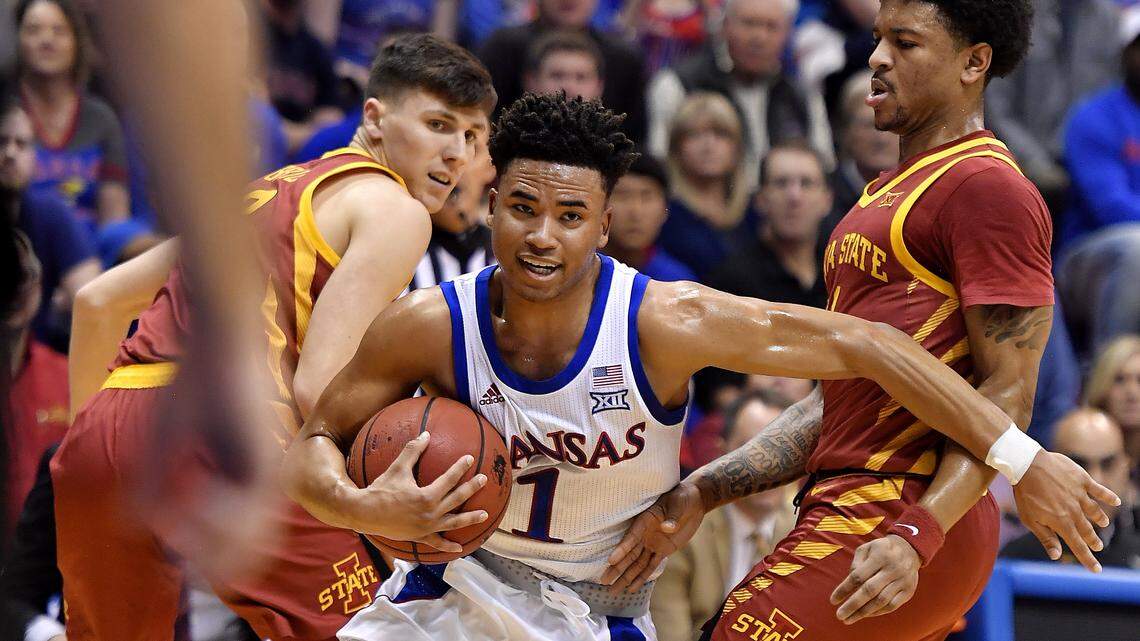 KU’s Devon Dotson blasts through a double team on his way to the basket during the first half of a 2019 game at Allen Fieldhouse.