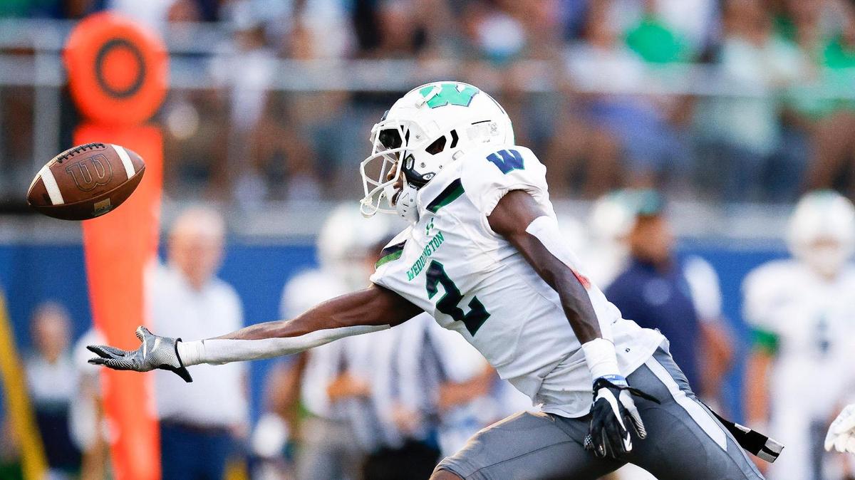 Weddington’s Zymill Patterson (2) misses a pass with pressure from Providence Day’s Channing Goodwin (7) during a game at Providence Day in Charlotte, N.C., Friday, Aug. 26, 2022.