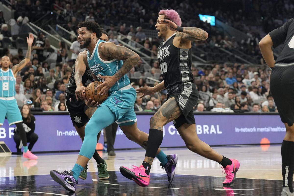 Charlotte Hornets forward Miles Bridges (0) drives to the basket past San Antonio Spurs forward Jeremy Sochan (10) during the first half at Frost Bank Center.